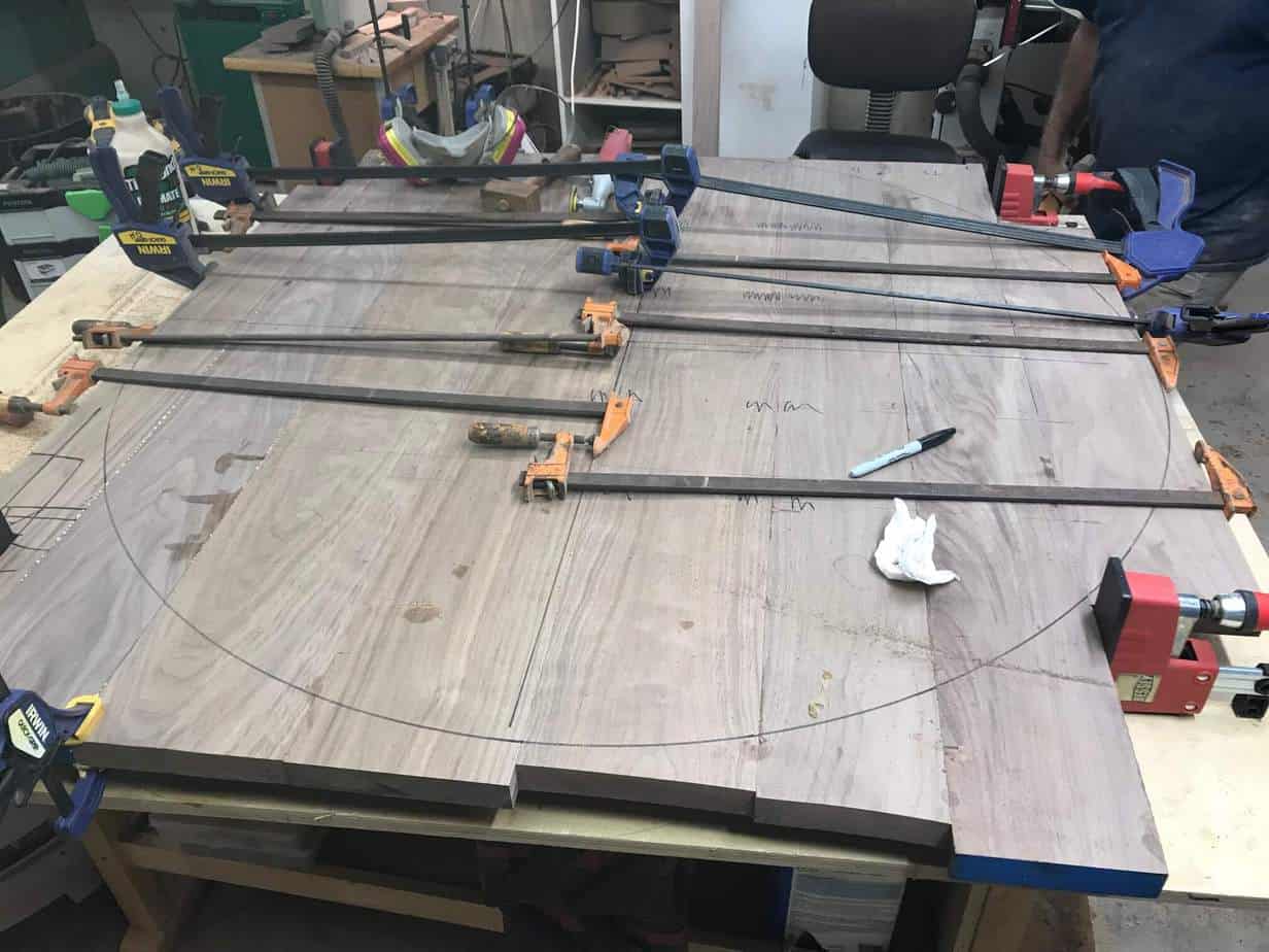 photo of boards clamped and glued together to make a coffee table top