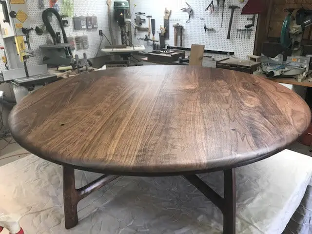 photo of a completed walnut coffee table in a workshop
