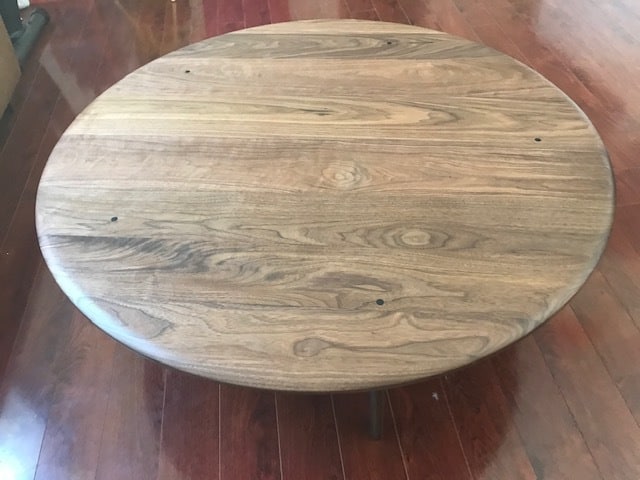 photo of a walnut coffee table on a wood floor
