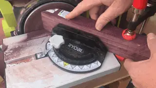 photo of a belt sander making a 45 degree joint