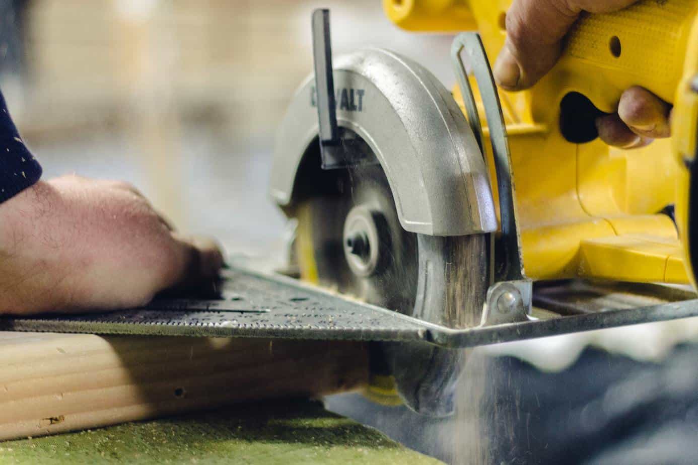 photo of someone using a circular saw to cut wood