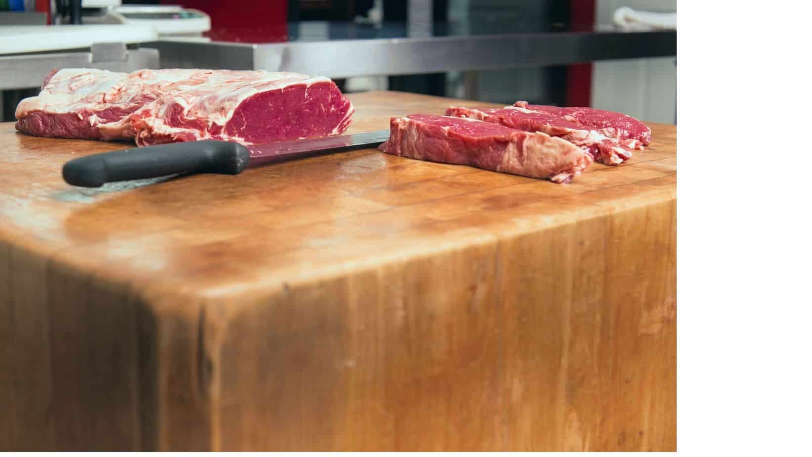 Photo of a cutting board with meat on it.
